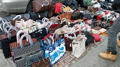 “No camera!” Canal street, New York: Fake bags, shoes  